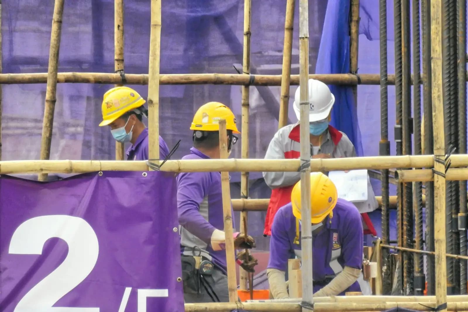 Crew in hard hats working on a construction site