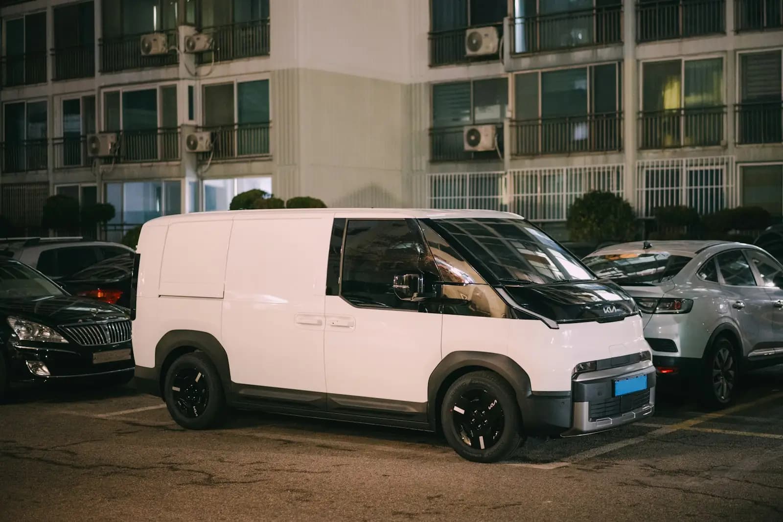 White delivery van parked at night